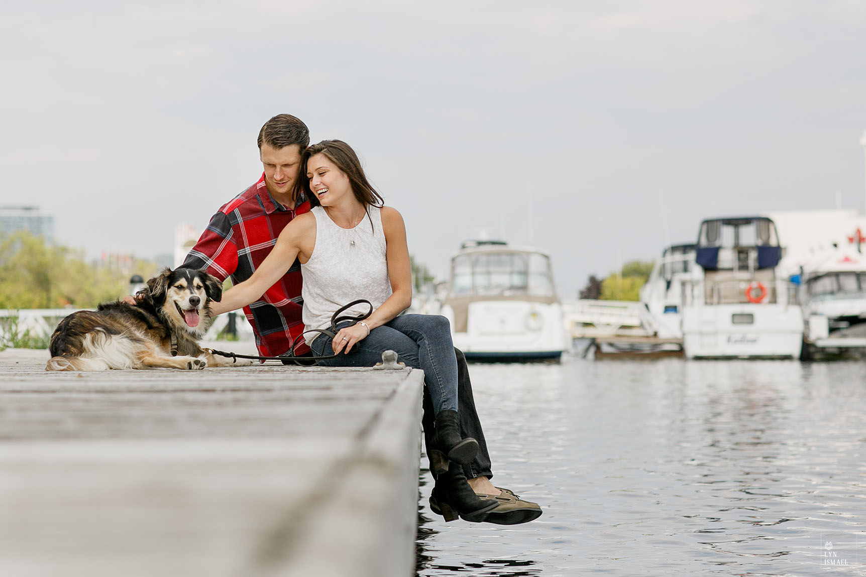 A couple with their beloved dog on the docks