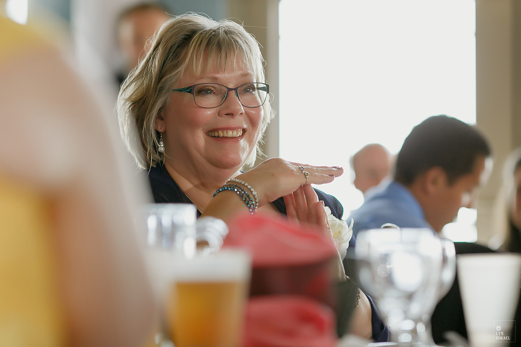 Mother of the groom reacts to her husband's speech about her son at a wedding at the Lakeview by Carmen's in Hamilton.