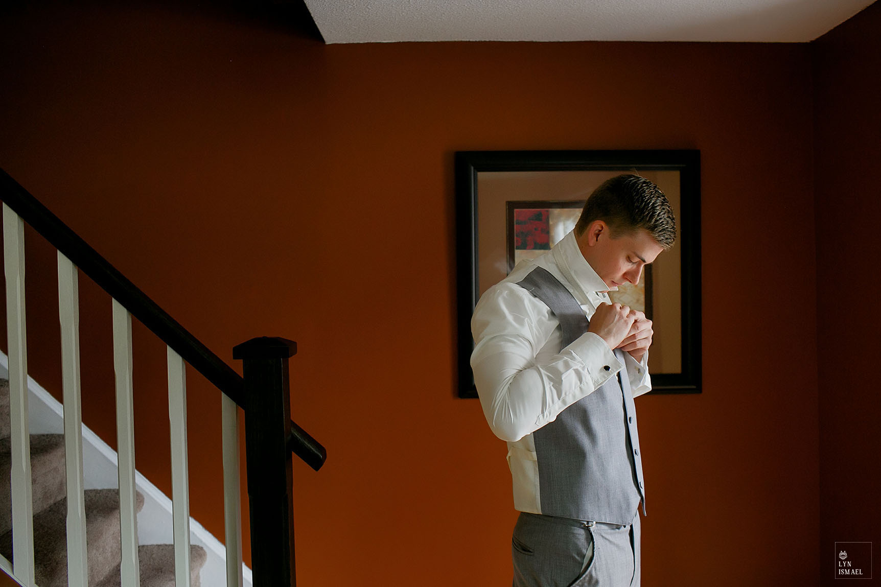 Groom gets dressed before his wedding in Cambridge, Ontario.