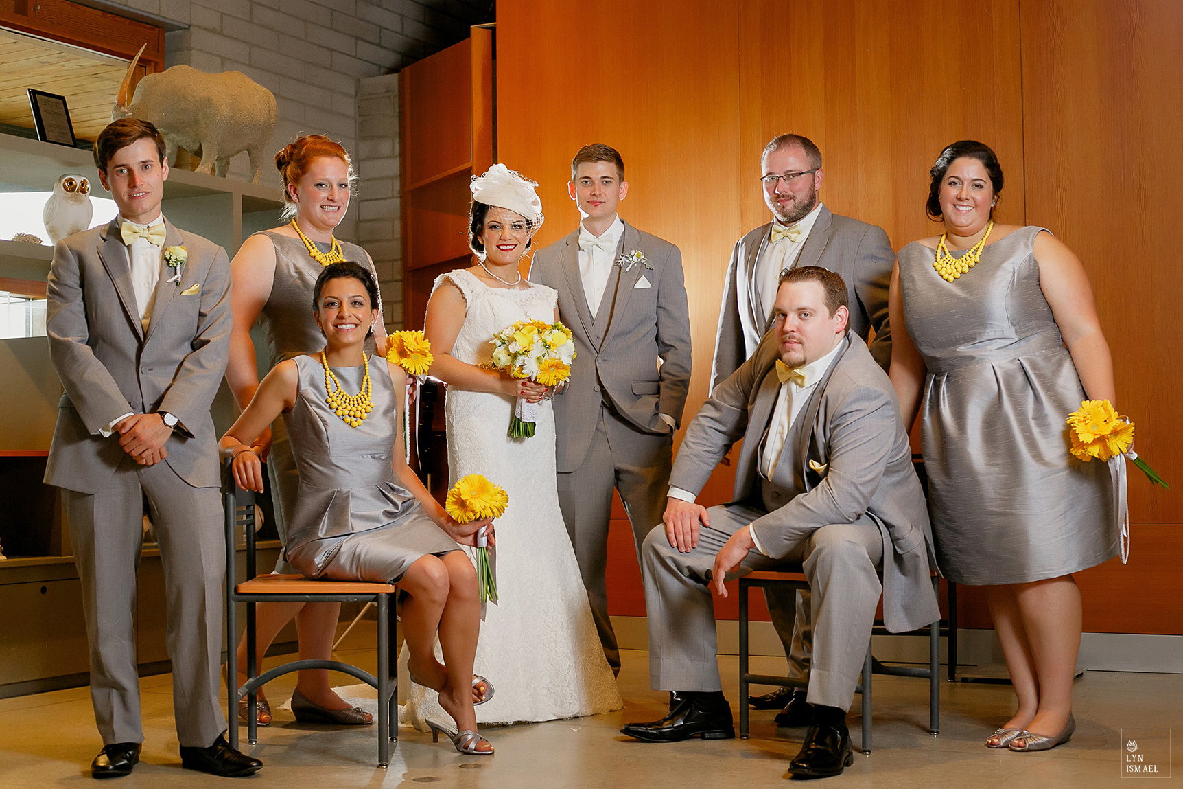 Bride and groom and their wedding party in grey and yellow
