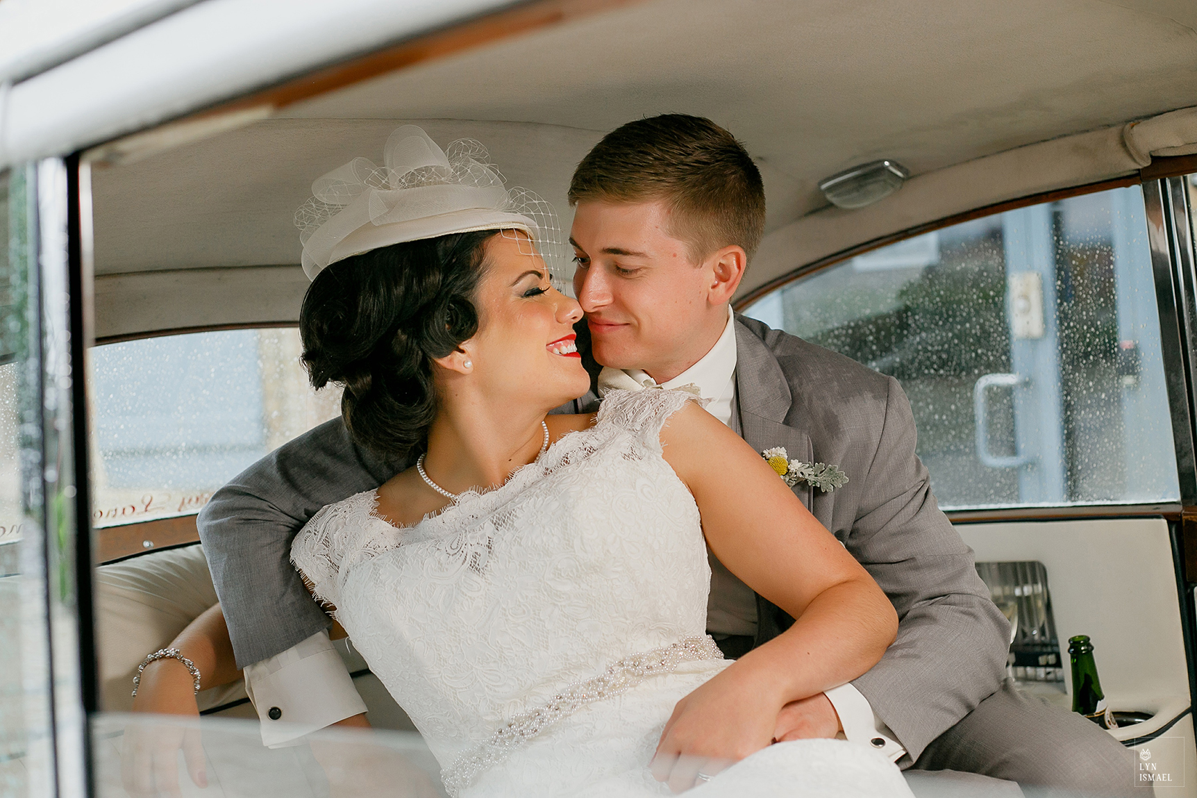 Bride and groom inside their rented vintage car at a wedding in Waterloo, Ontario.