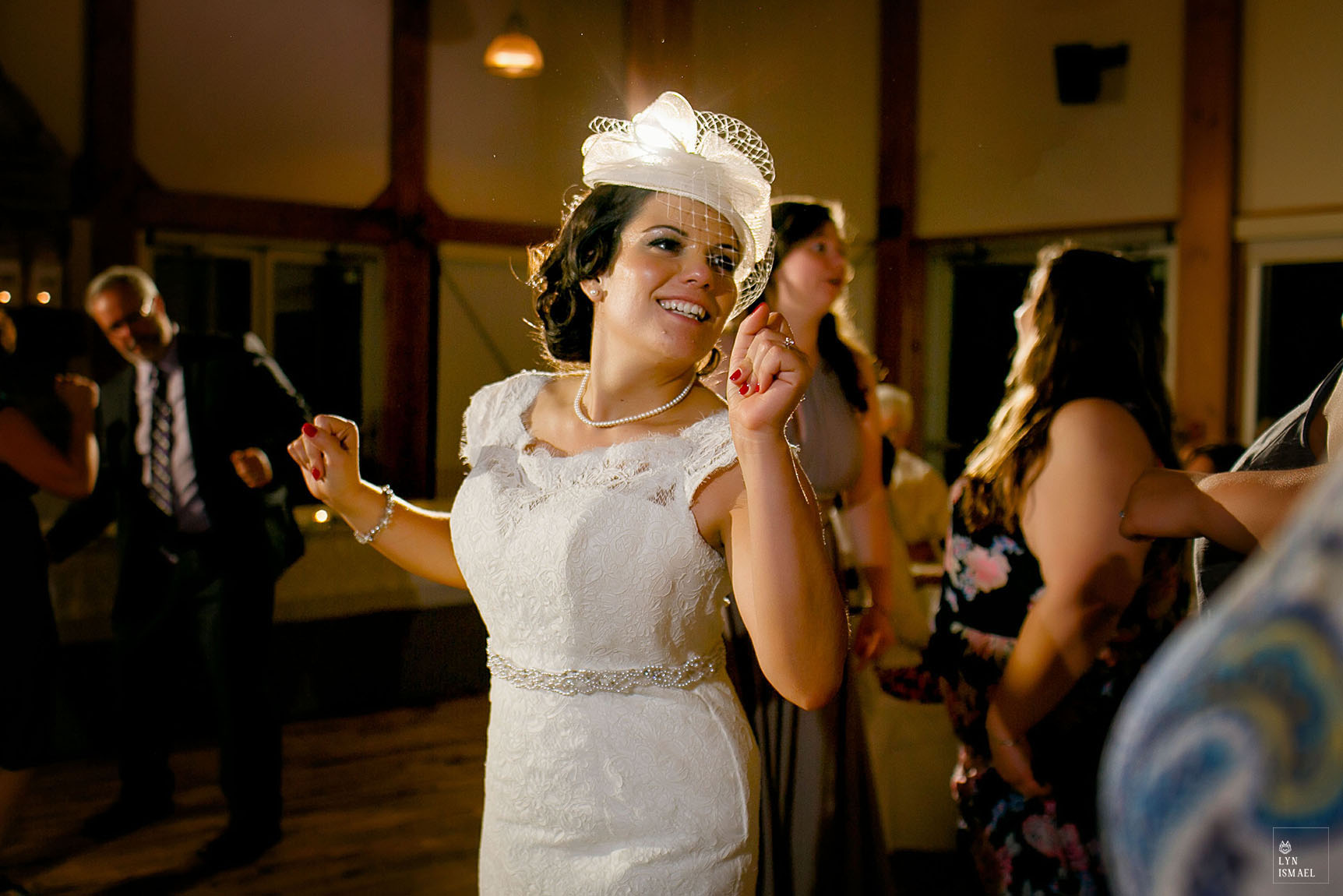 Bride dances with her guests at her wedding reception in Grey Silo in Waterloo, Ontario.
