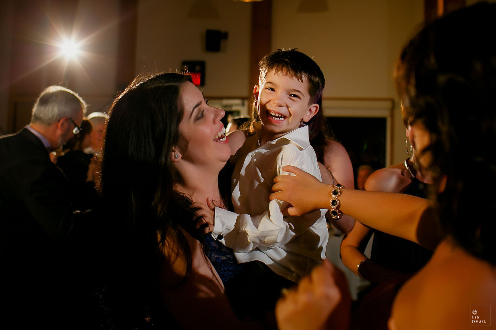 Little boy dances with his mother at a wedding reception in Grey Silo, a rustic wedding venue in Waterloo, Ontario.