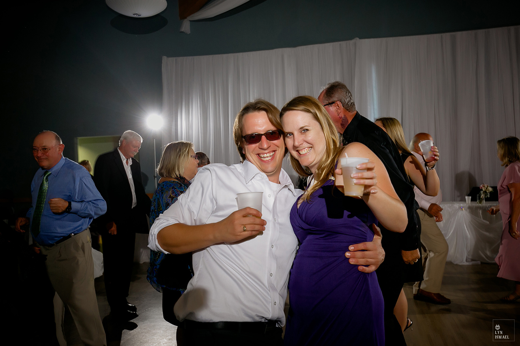 A couple poses for the camera while on the dance floor at The Lakeview by Carmen's