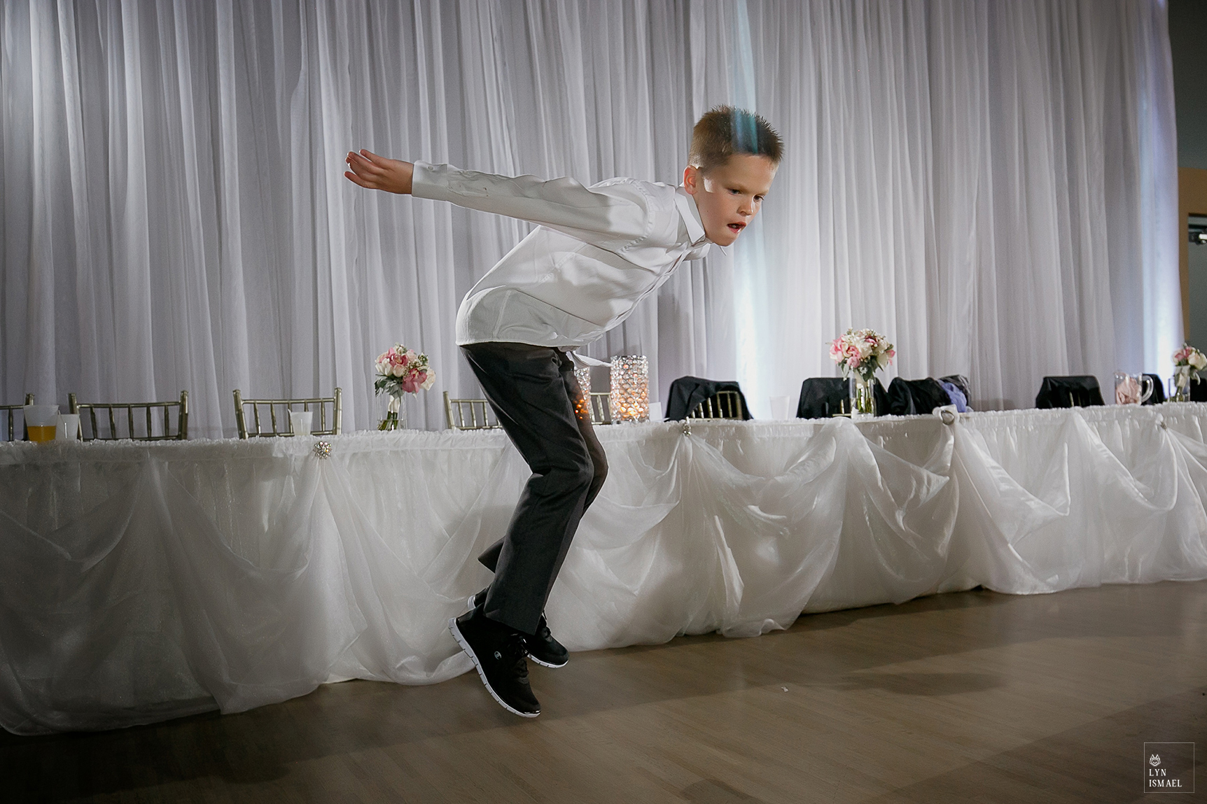 Boy dancing on the dance floor at a wedding reception at The Lakeview by Carmen's
