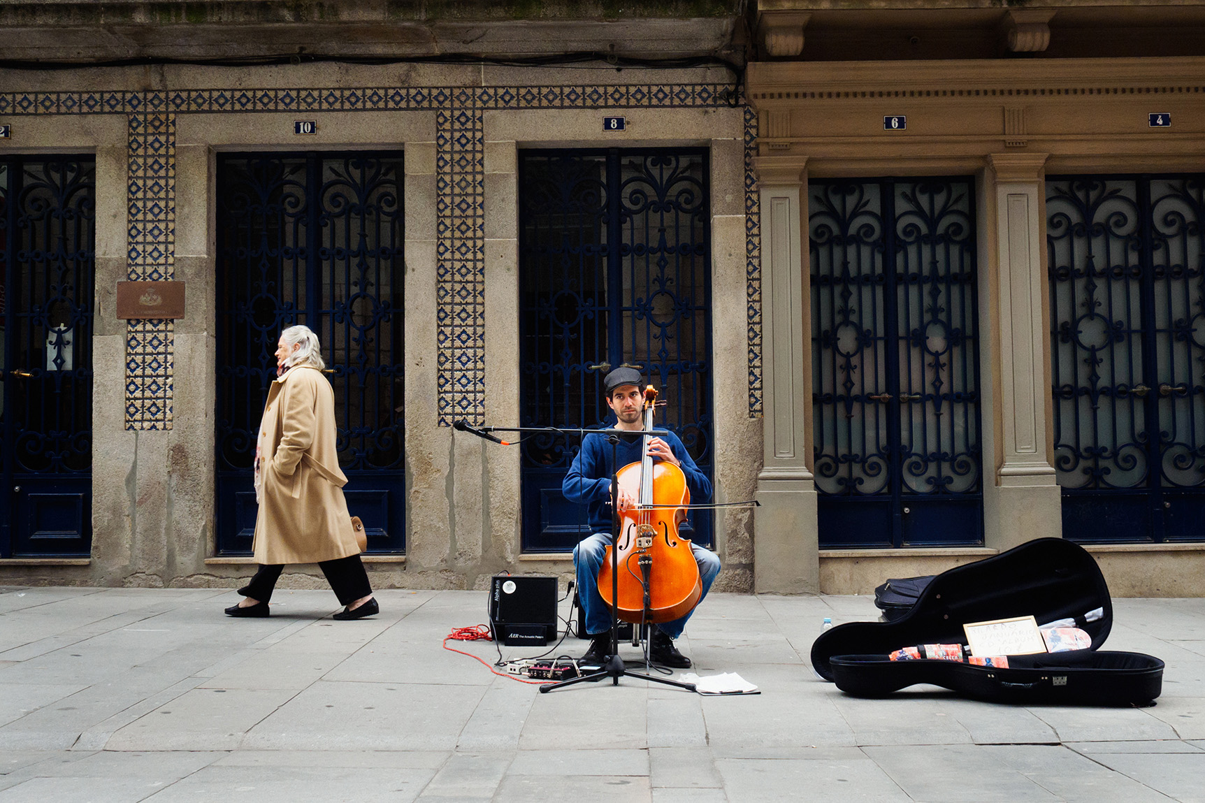 Man playing a cello close to the Ribeira in Porto