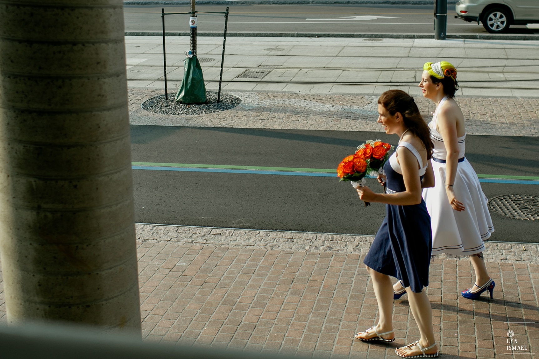 Bride and her sister, the maid of honour walking to the port