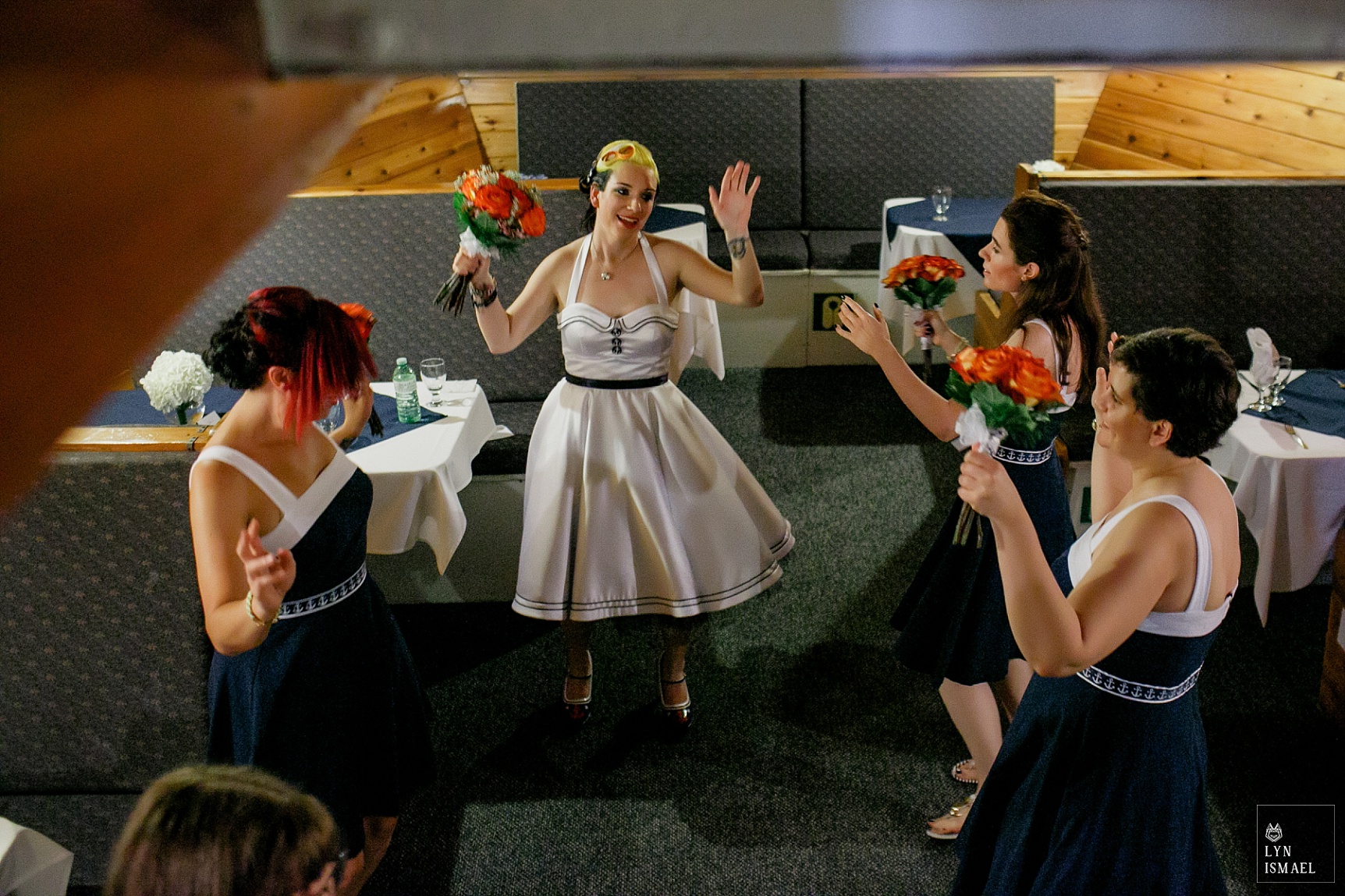 The bride and her bridesmaids perform a rain dance aboard the Empire Sandy.