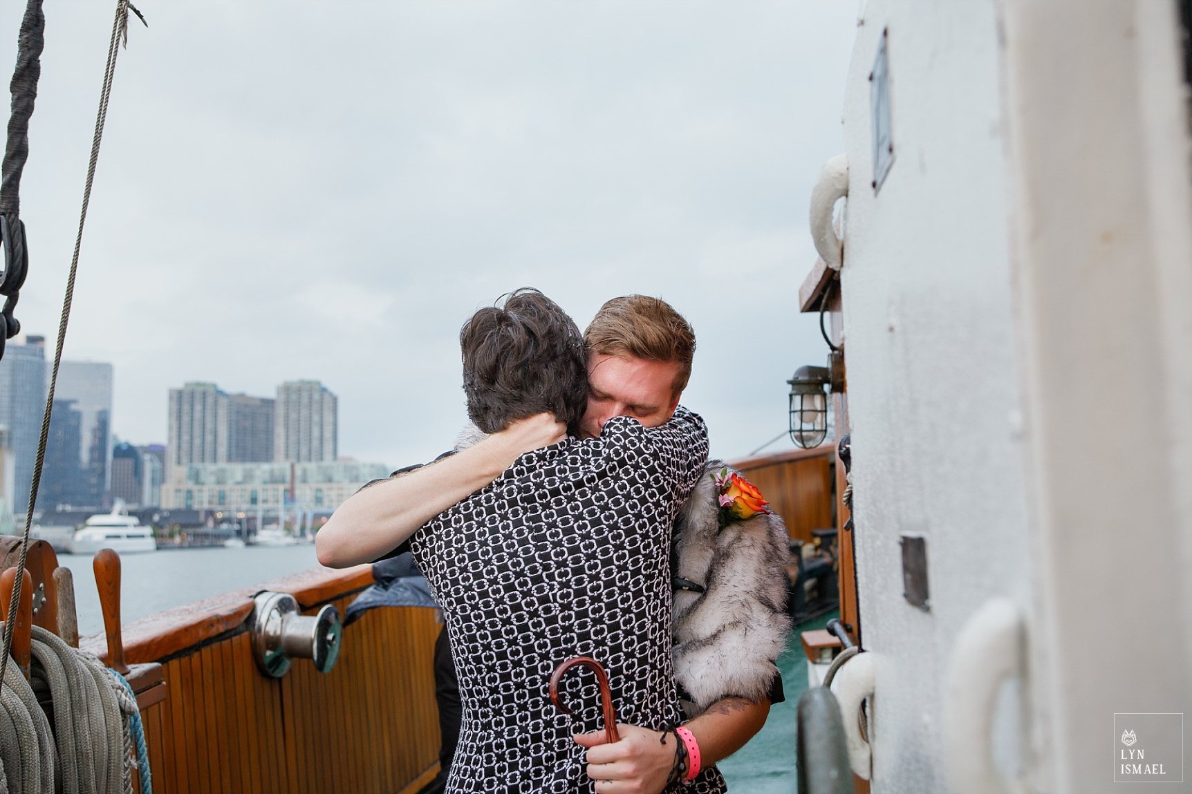 Groom hugs his mom before his wedding ceremony aboard the Empire Sandy