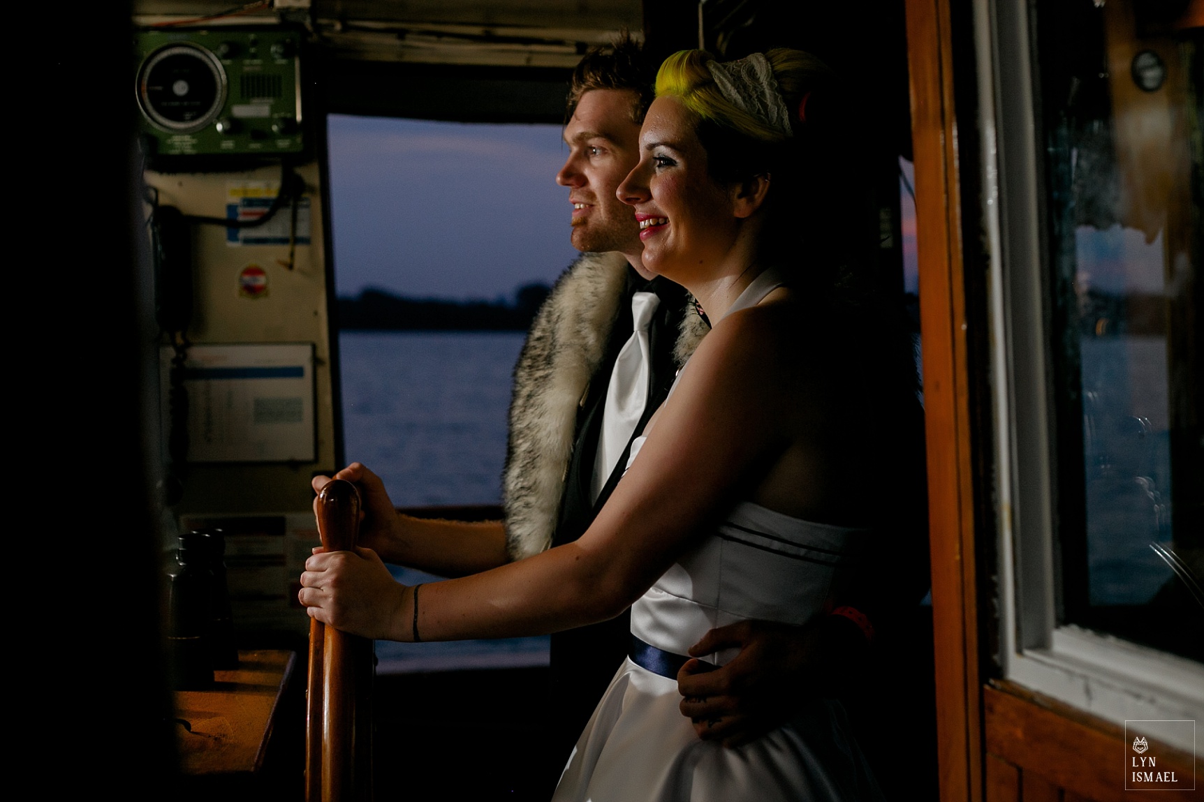 Bride and groom learns how to steer the Empire Sandy tall ship.