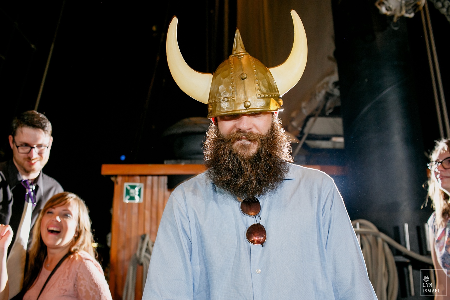 Wedding guest wears a viking helmet on the dance floor