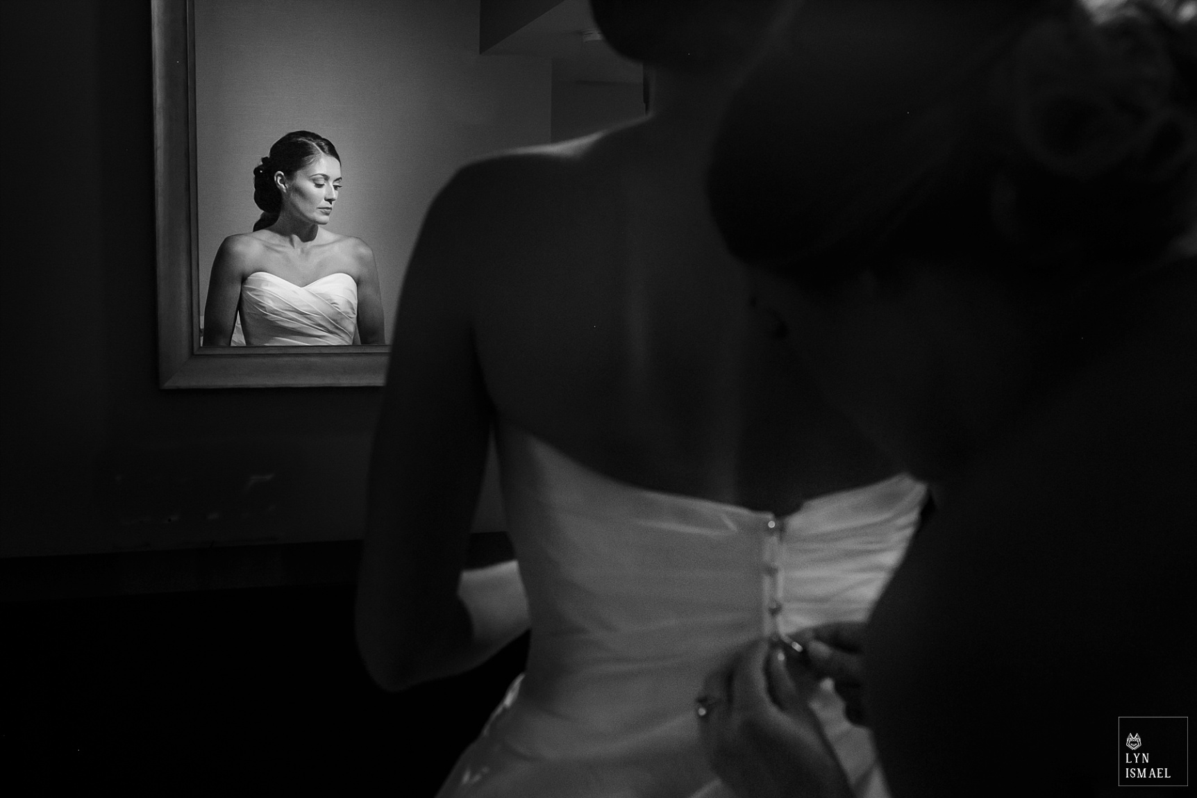 Bride getting her dress done