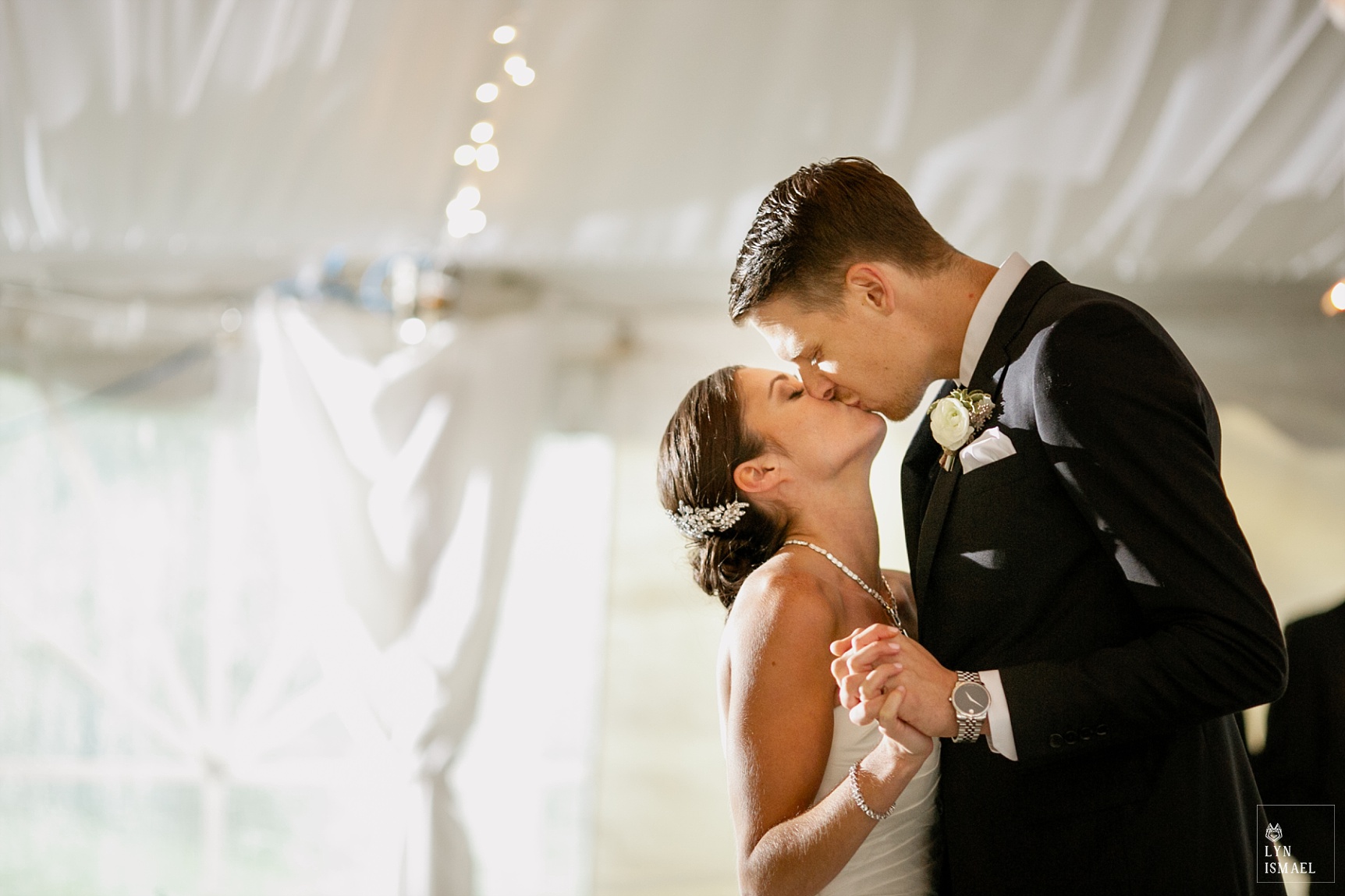 Bride and groom kisses