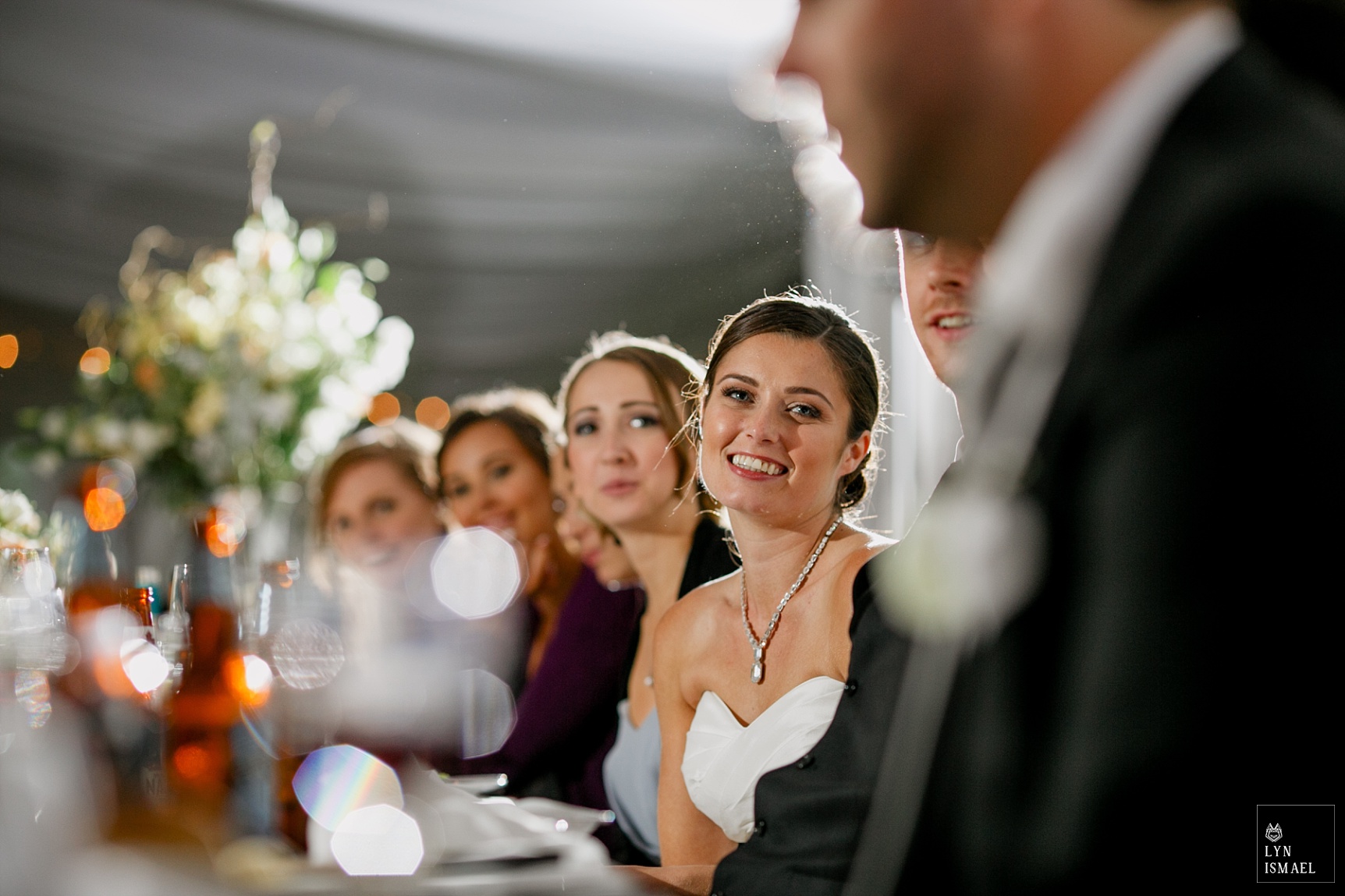 Bride listens to speeches at her Knollwood Golf Club wedding reception