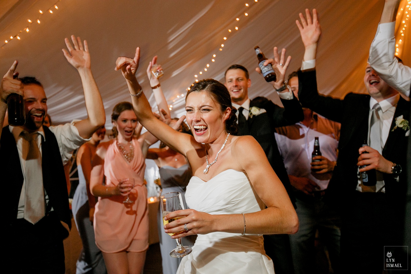 Bride dances with guests at her Knollwood Golf Club wedding reception