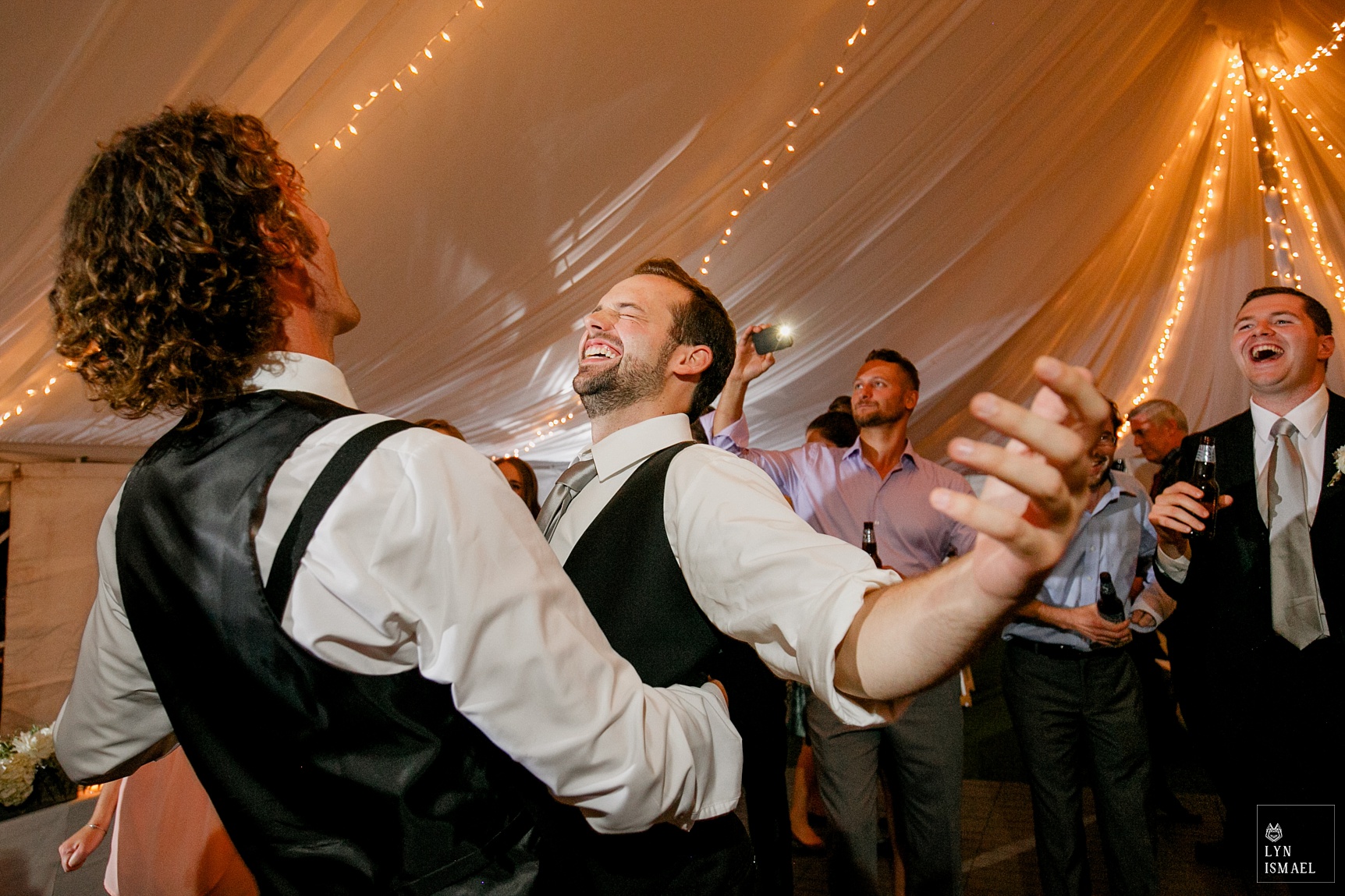 Groomsmen dancing at a Knollwood Golf Club wedding.