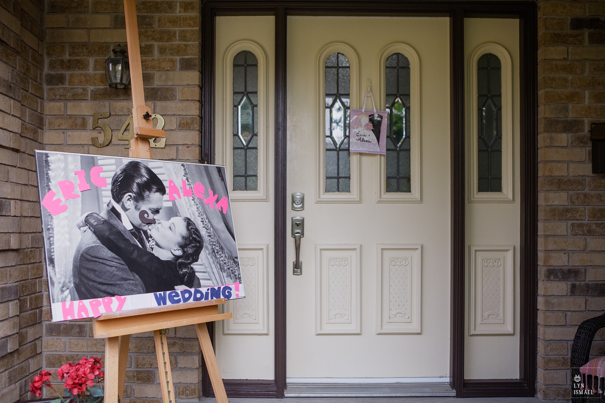 A poster outside the groom's house on his wedding day.