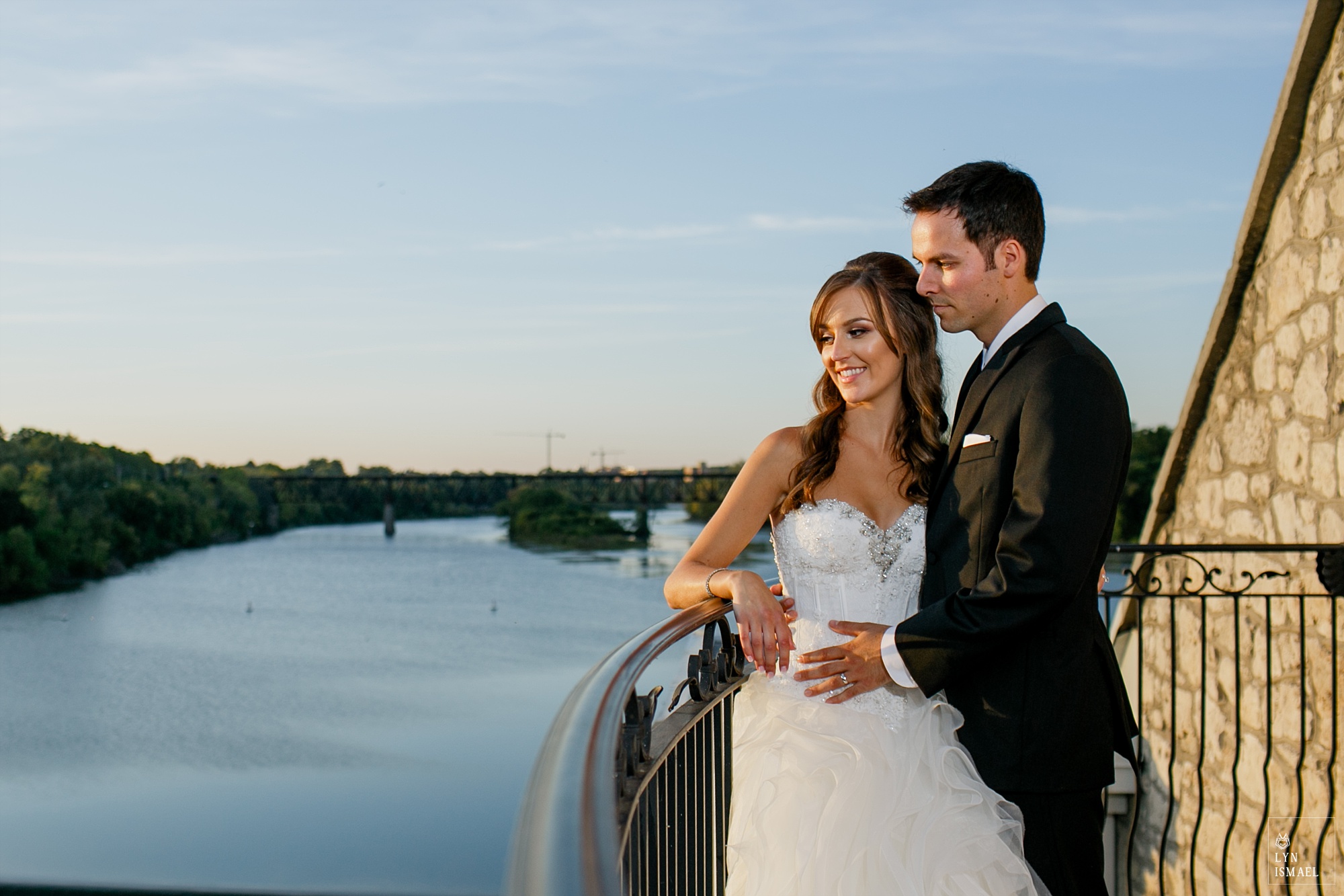 Cambridge Mill wedding photo at the balcony overlooking the river.