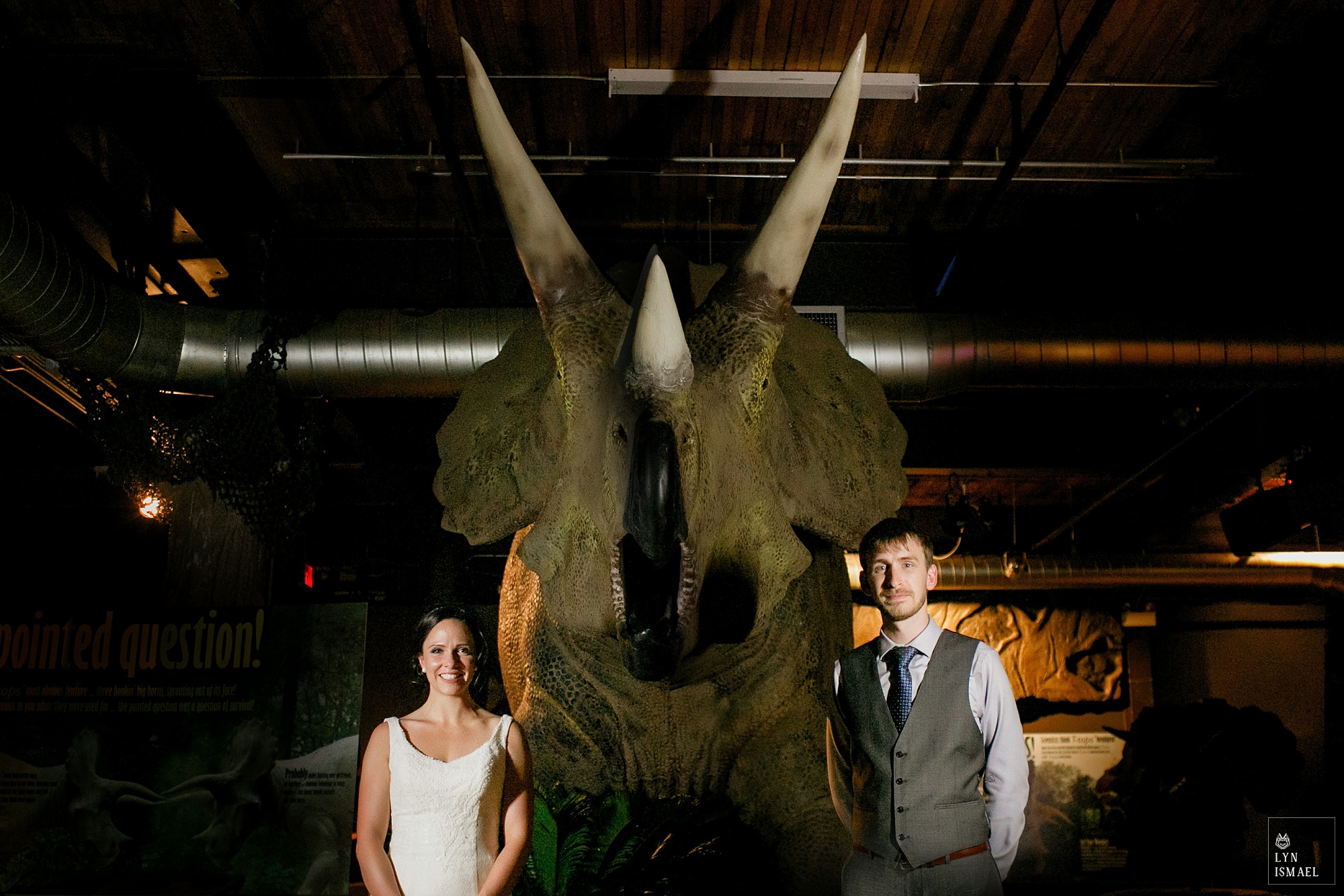 Wedding photo with a triceratops dinosaur