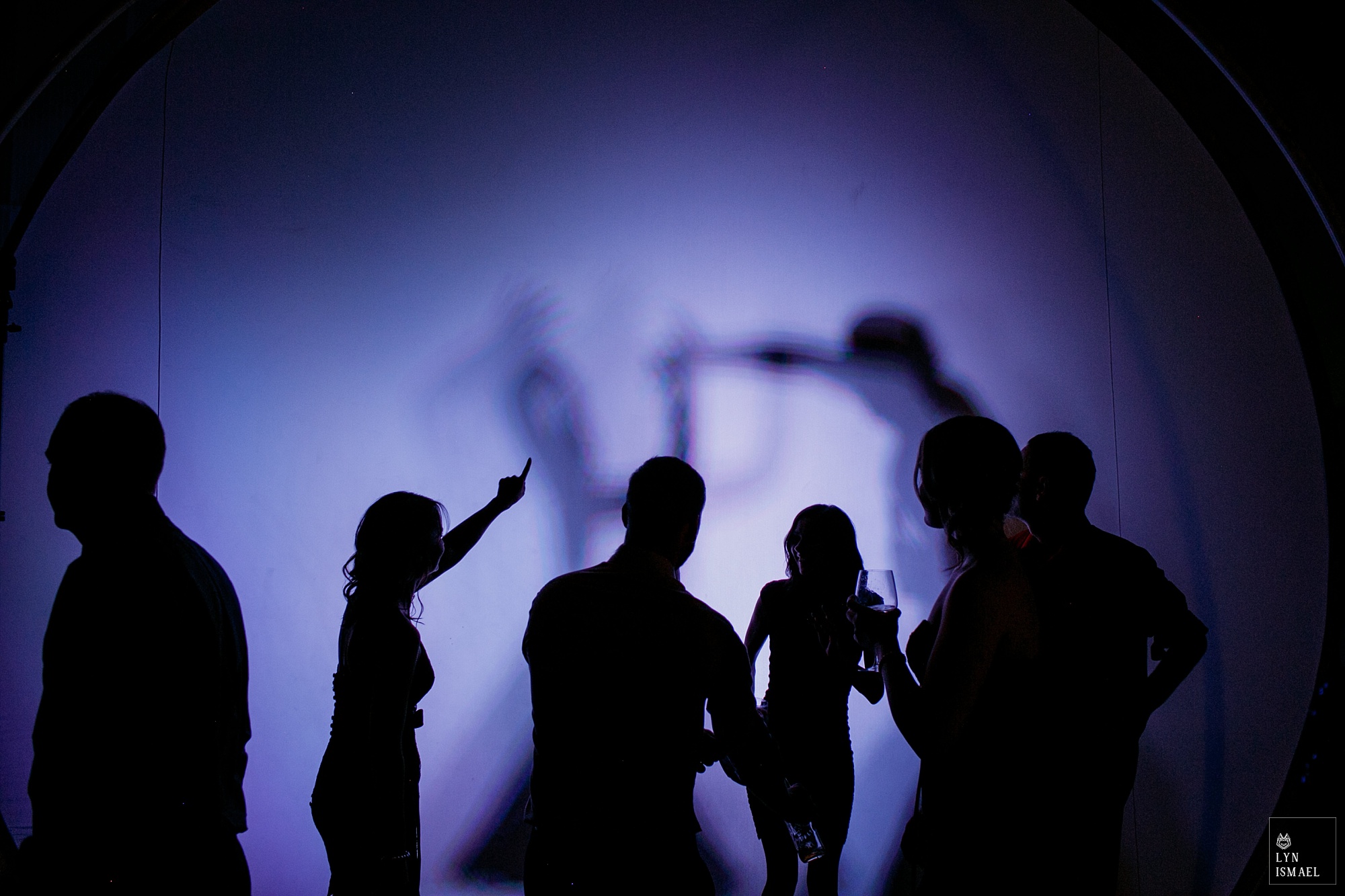 silhouettes of guests dancing at a wedding reception at THEMUSEUM in Kitchener