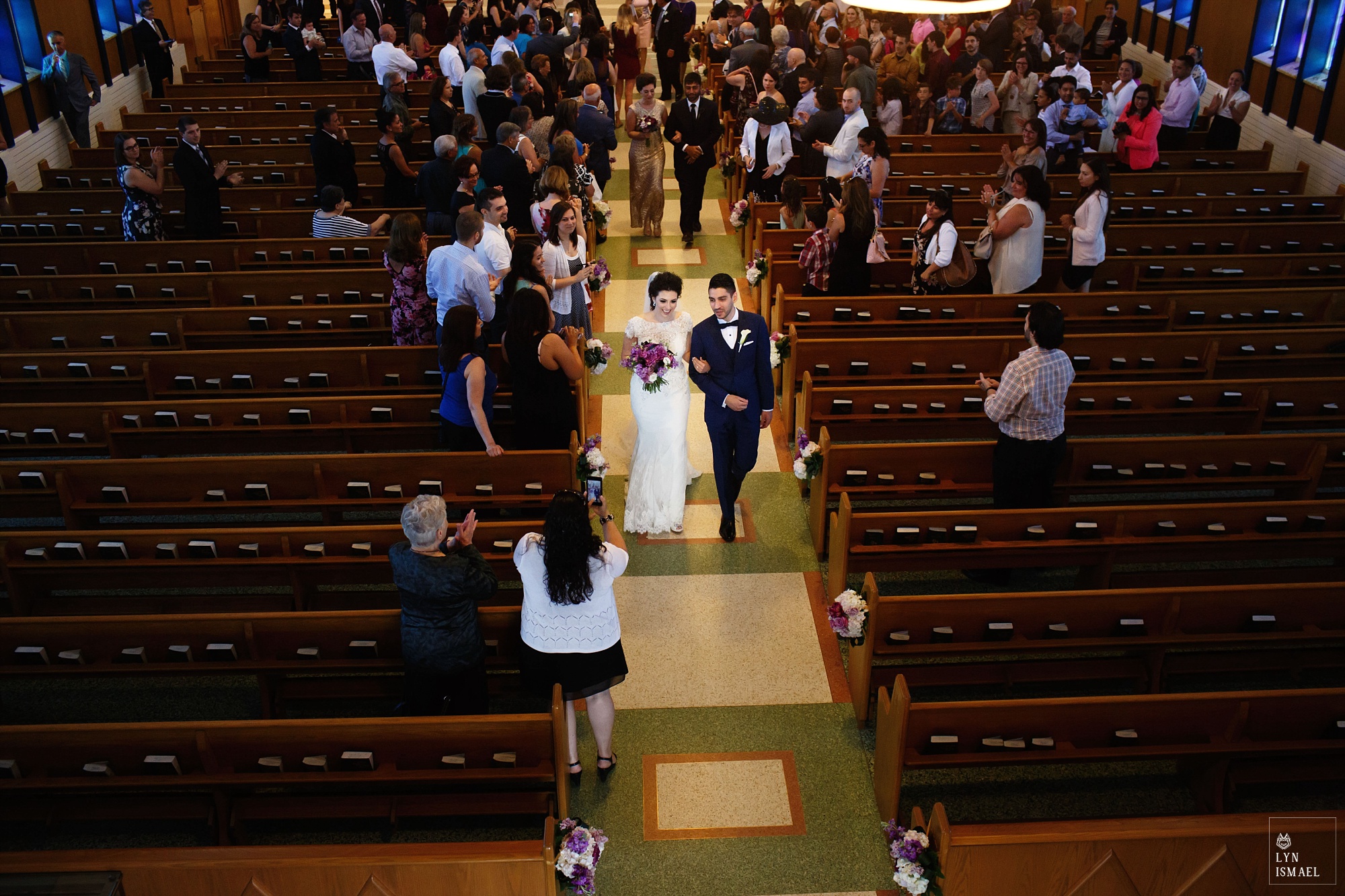 Bride and groom recessional at St Gregory Church in Toronto
