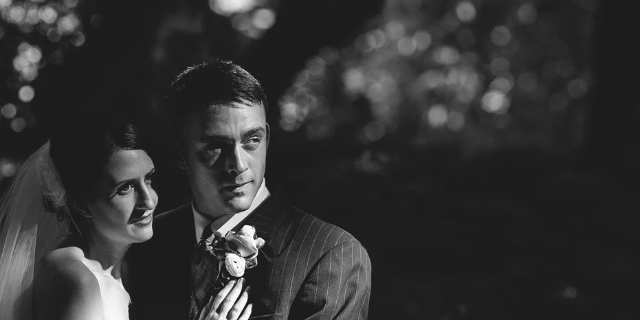 A film noir inspired photograph of the bride and groom as photographed by Toronto wedding photojournalist