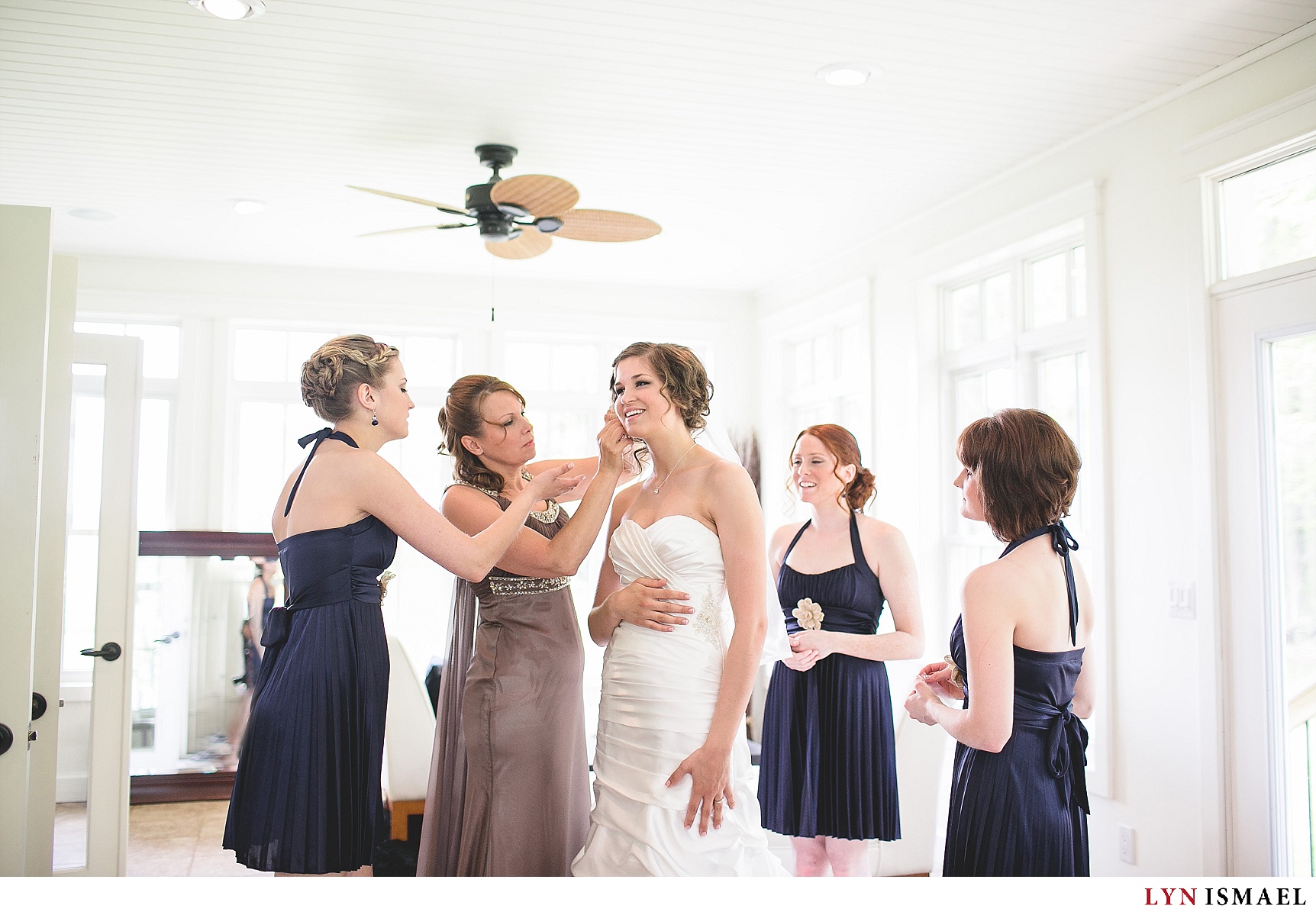 the bride gets ready in a bright room
