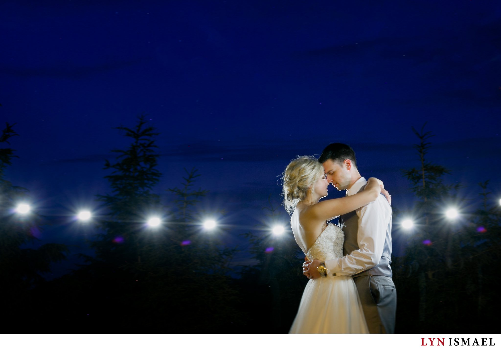 Night portrait of the bride and groom at Alma Community Centre