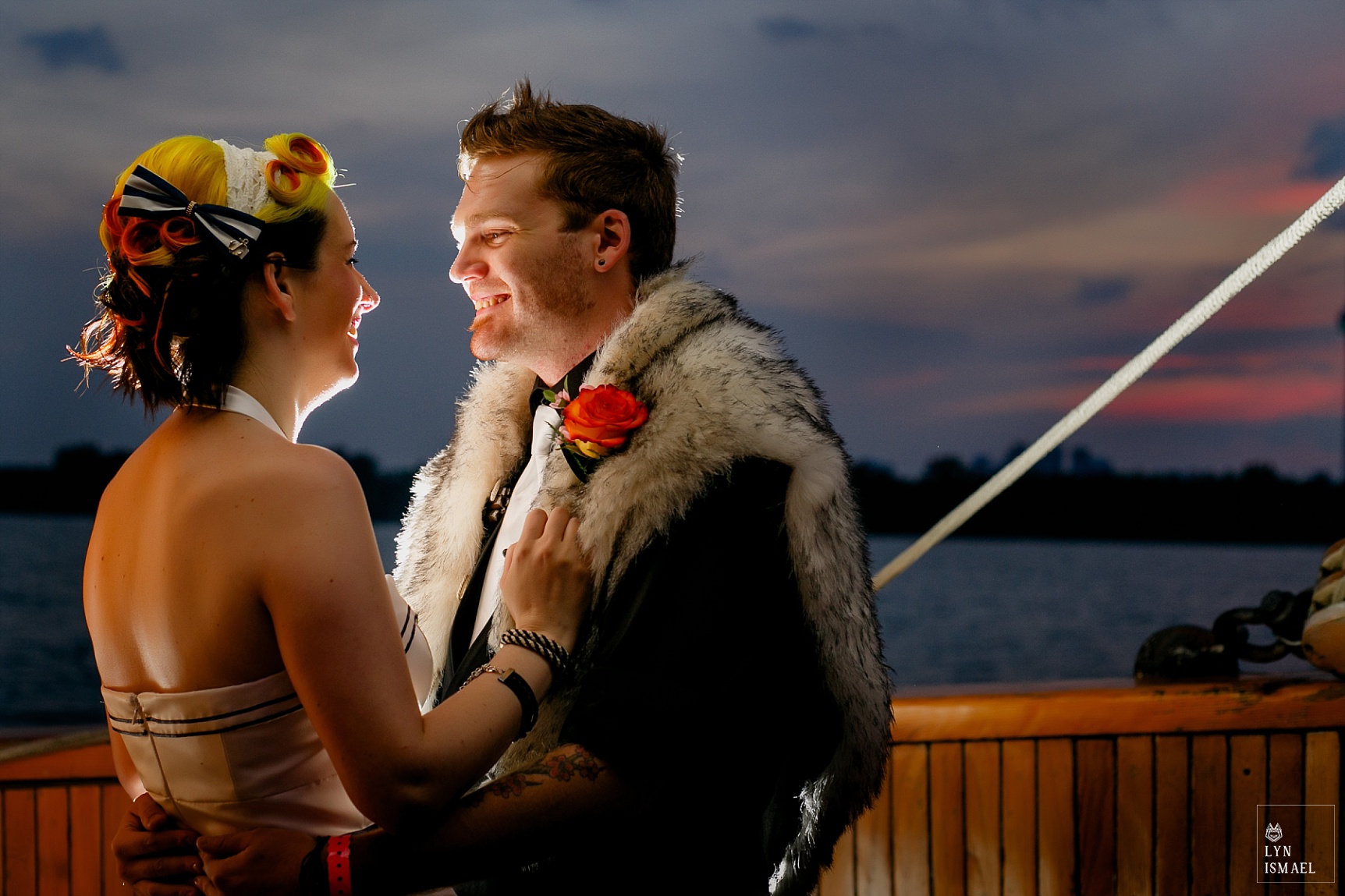 Portrait of the bride and groom at sunset on board the Empire Sandy