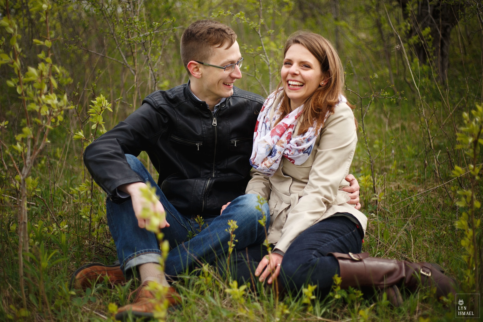 An engaged couple in Kitchener having fun during their engagement session